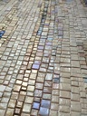 Large neutral mosaic wall art on beige background with colorful stripes and shimmering gold accents, modern textured abstract design
