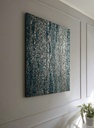 Long dark blue mosaic wall art with metallic silver texture on vertical canvas