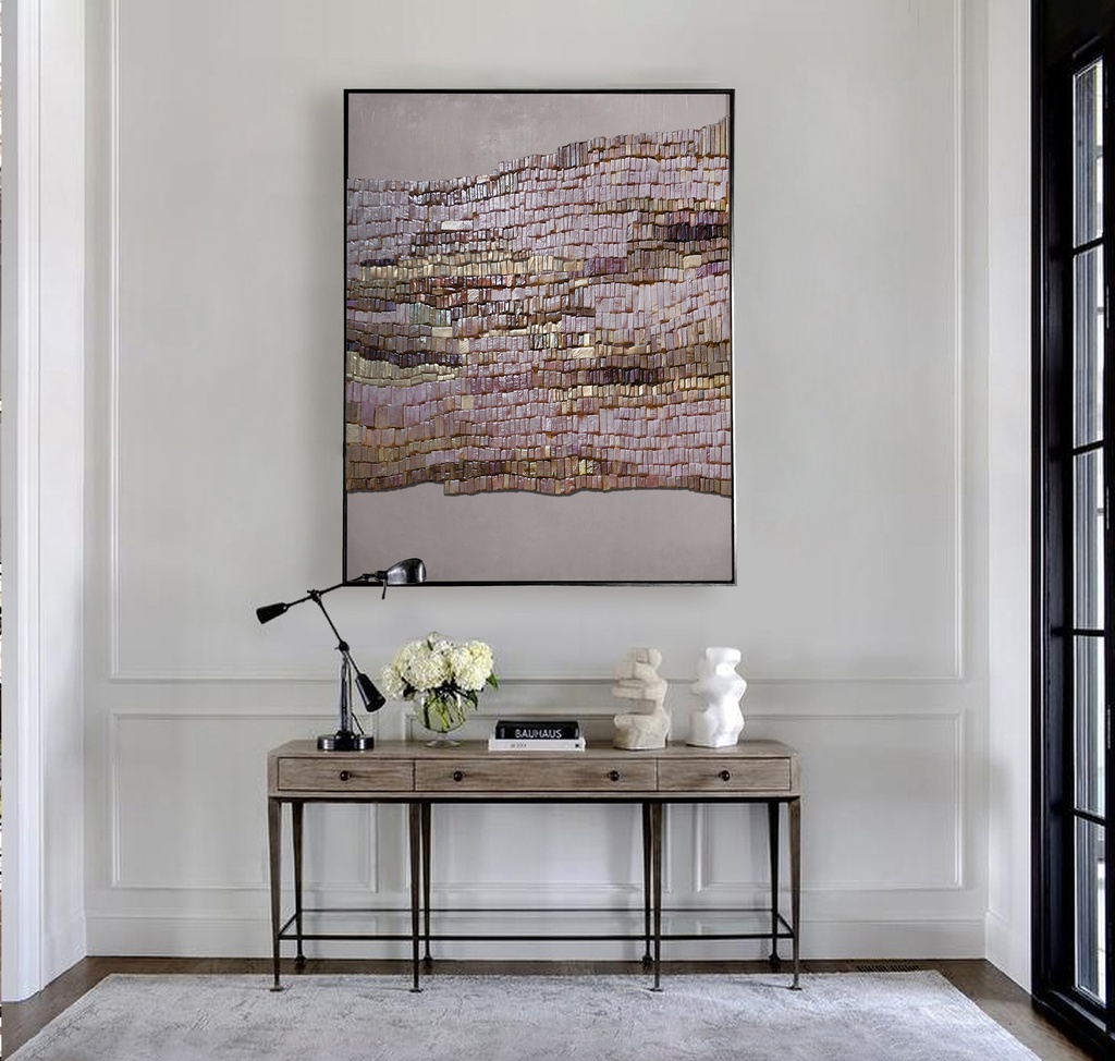 Beige mosaic wall art with vertical tiles in rose, bronze, and gold tones on a soft neutral background