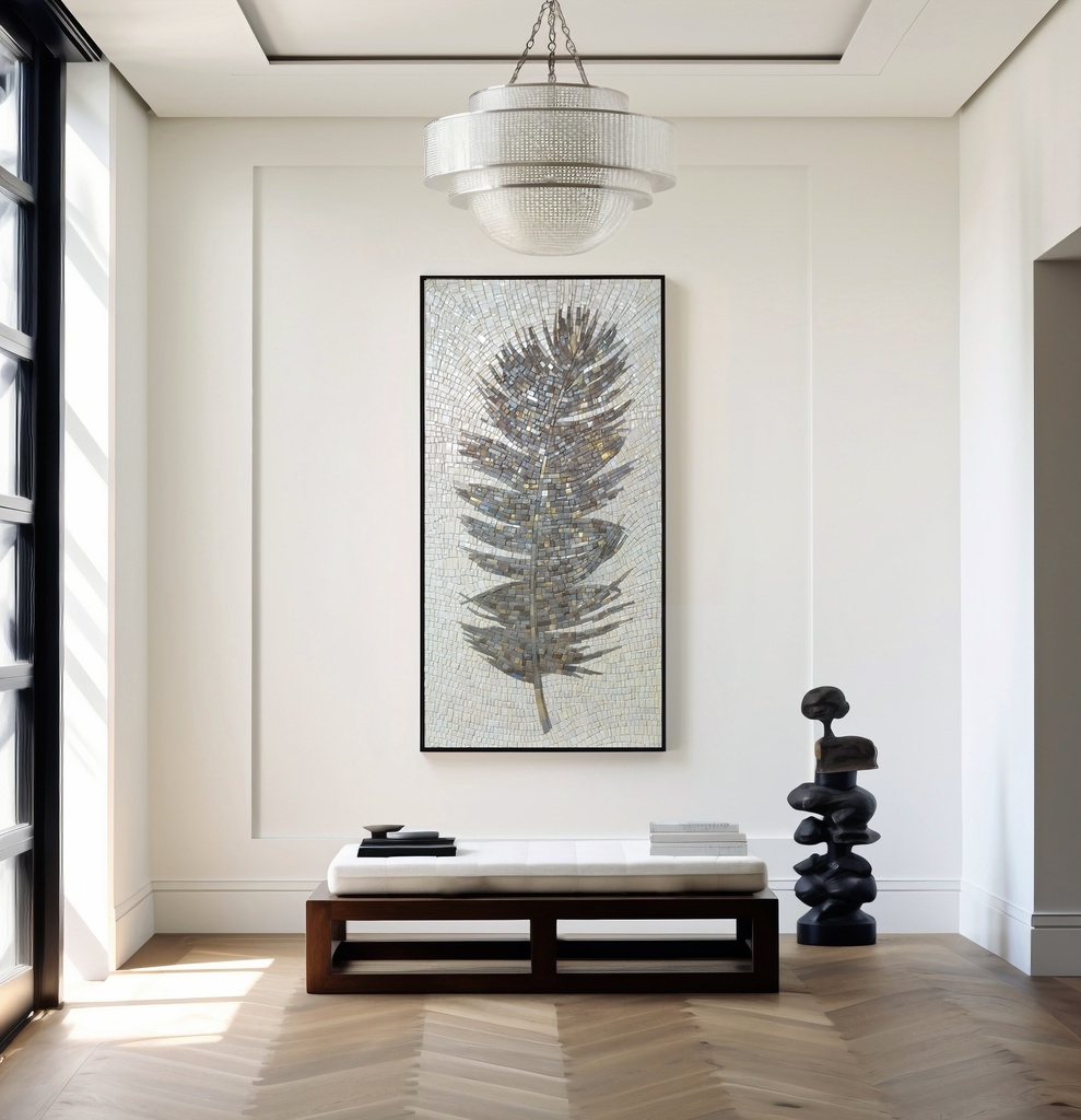 Vertical mosaic wall art featuring a stylized dark grey feather with silver and gold details on a pale icy background