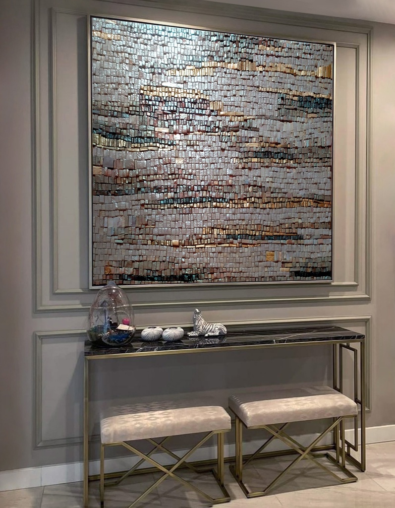 Gray and gold mosaic wall art with textured tiles arranged vertically and horizontally for modern interior decor