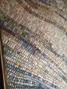 Detail of beige mosaic wall art on canvas with intertwining blue and green accents