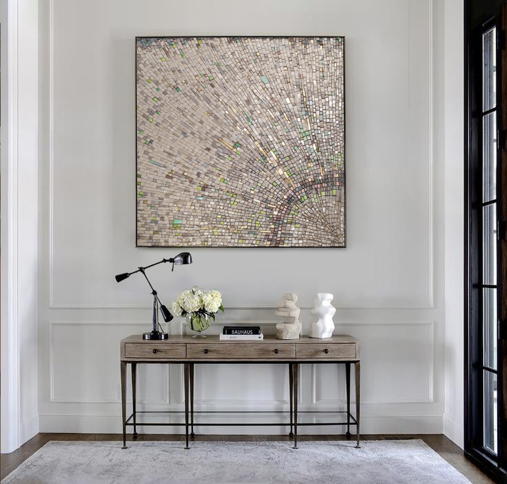 Large mosaic wall art with a radiant sunburst pattern in neutral and gold tones