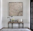 Large mosaic wall art with a radiant sunburst pattern in neutral and gold tones