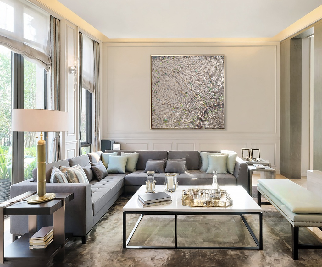 Large mosaic wall art with a radiant sunburst pattern in neutral and gold tones
